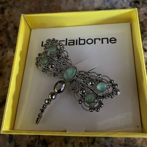 Beautiful dragonfly pin. New in box.  Stones are pale green